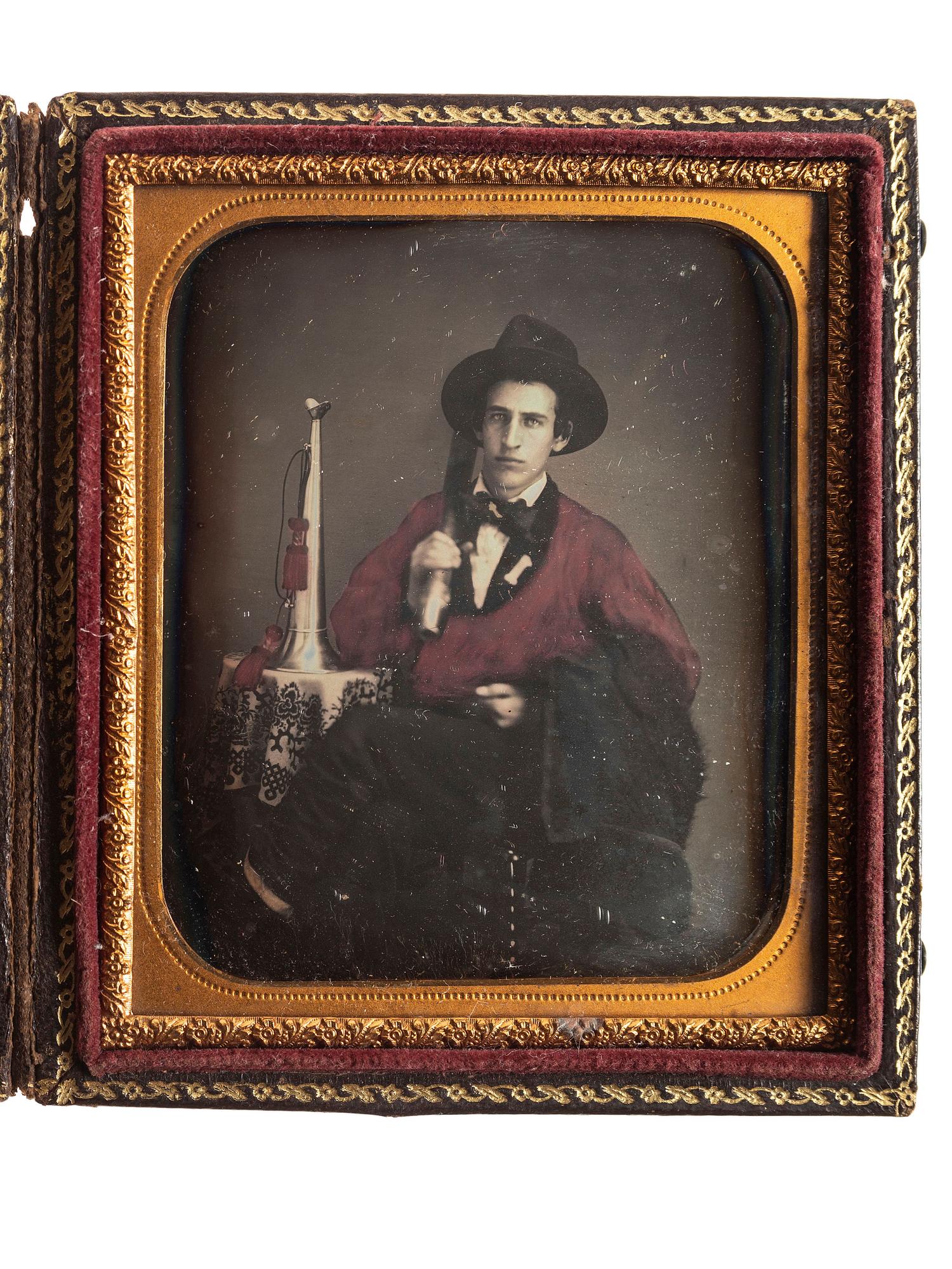 [EARLY PHOTOGRAPHY]. A group of 2 hand-tinted daguerreotypes of firefighters, including quarter plate and sixth plate images.