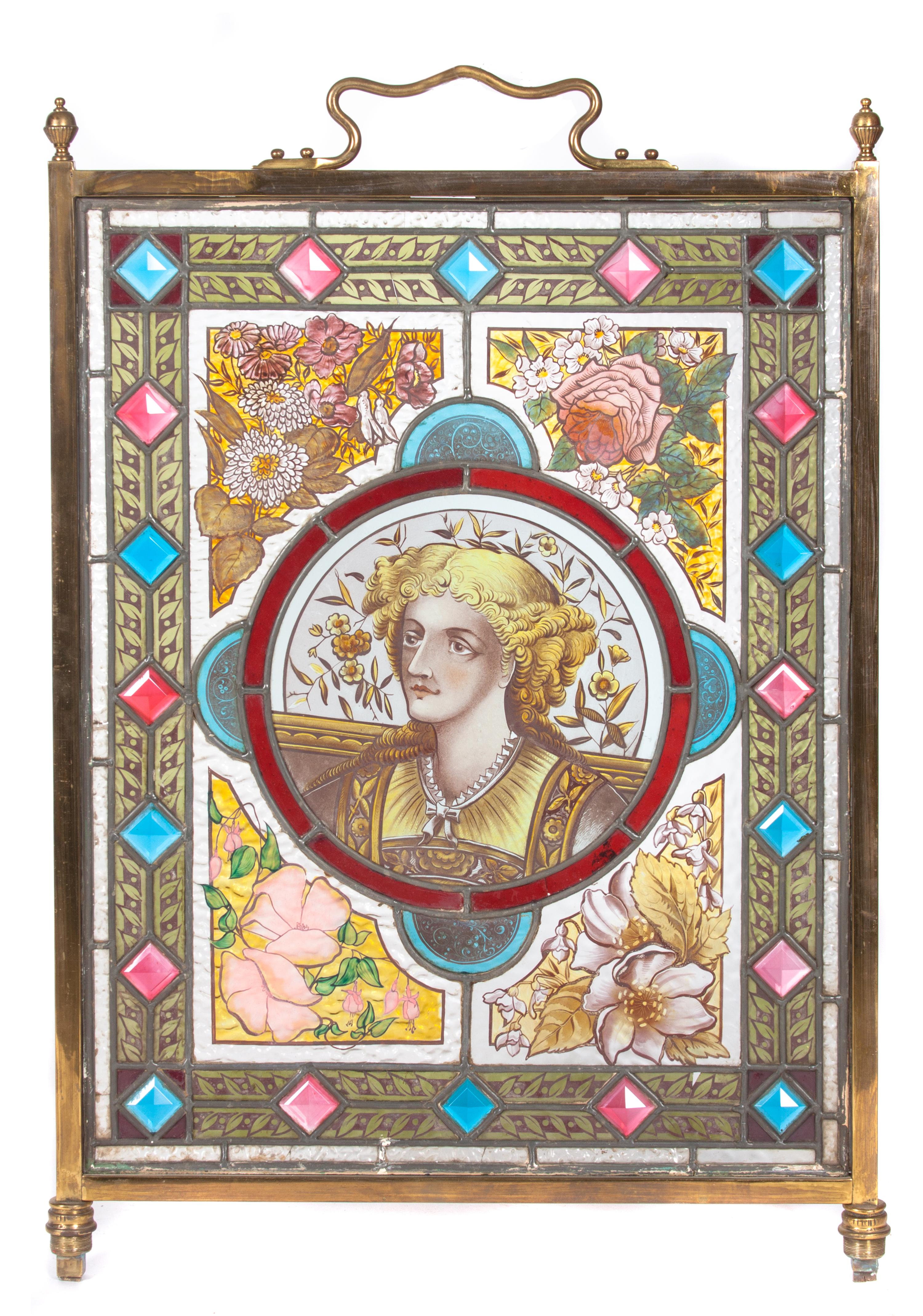 A Victorian Stain Leaded and Jewel Glass Fire Screen Height 33 1/2 x width 20 1/2 inches.