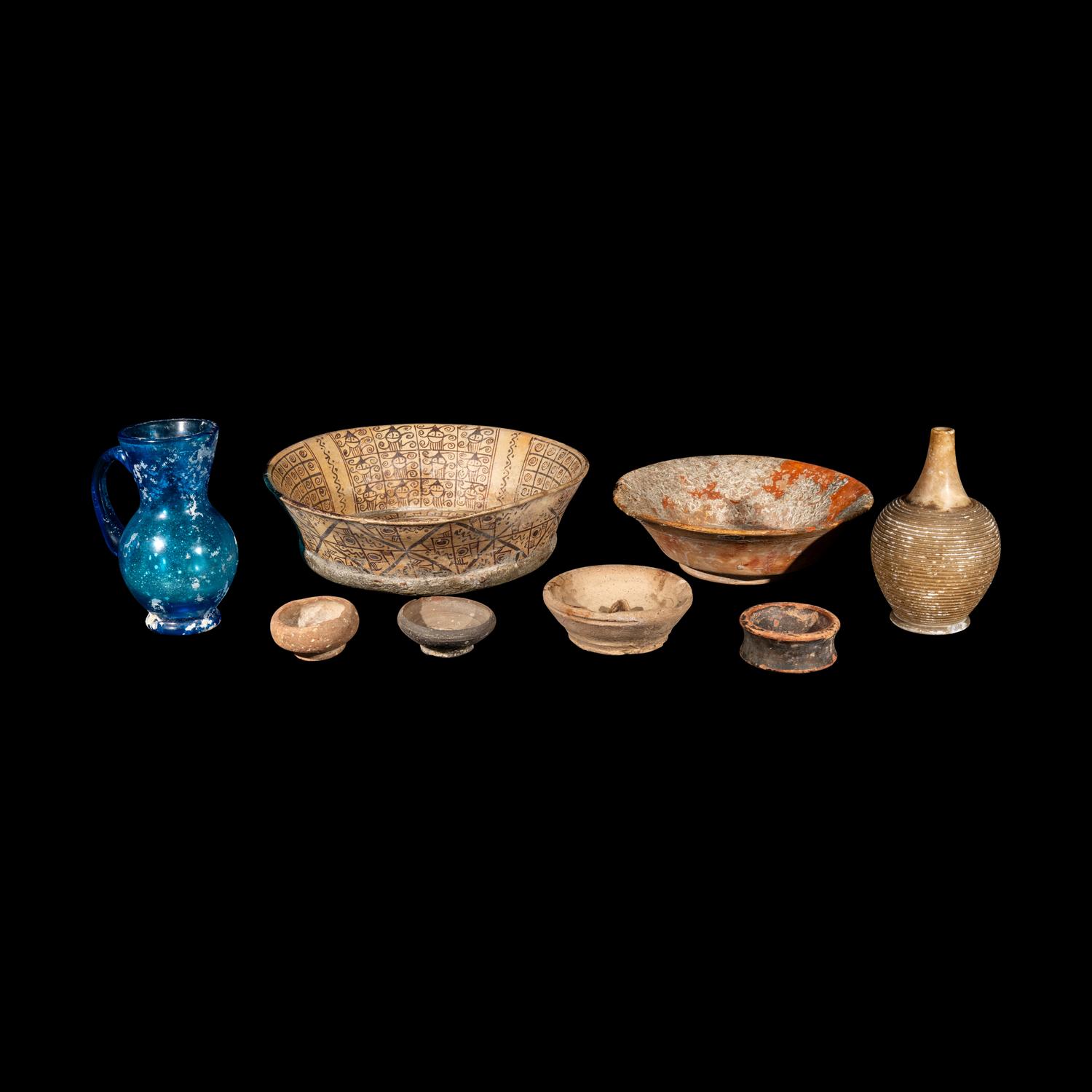 Eight Western Asiatic and Greco-Roman Terracotta, Alabaster, and Blue Glass Vessels