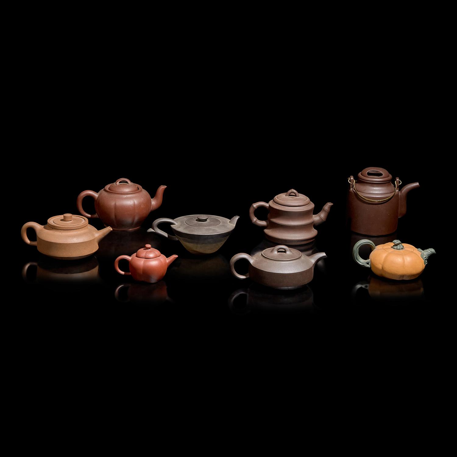 A Group of Eight Assorted Yixing Zisha Stoneware Teapots 宜興紫砂茶壺八件