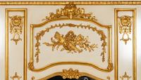 A Pair of Louis XVI Style Cream-Painted and Parcel Gilt Mirrors