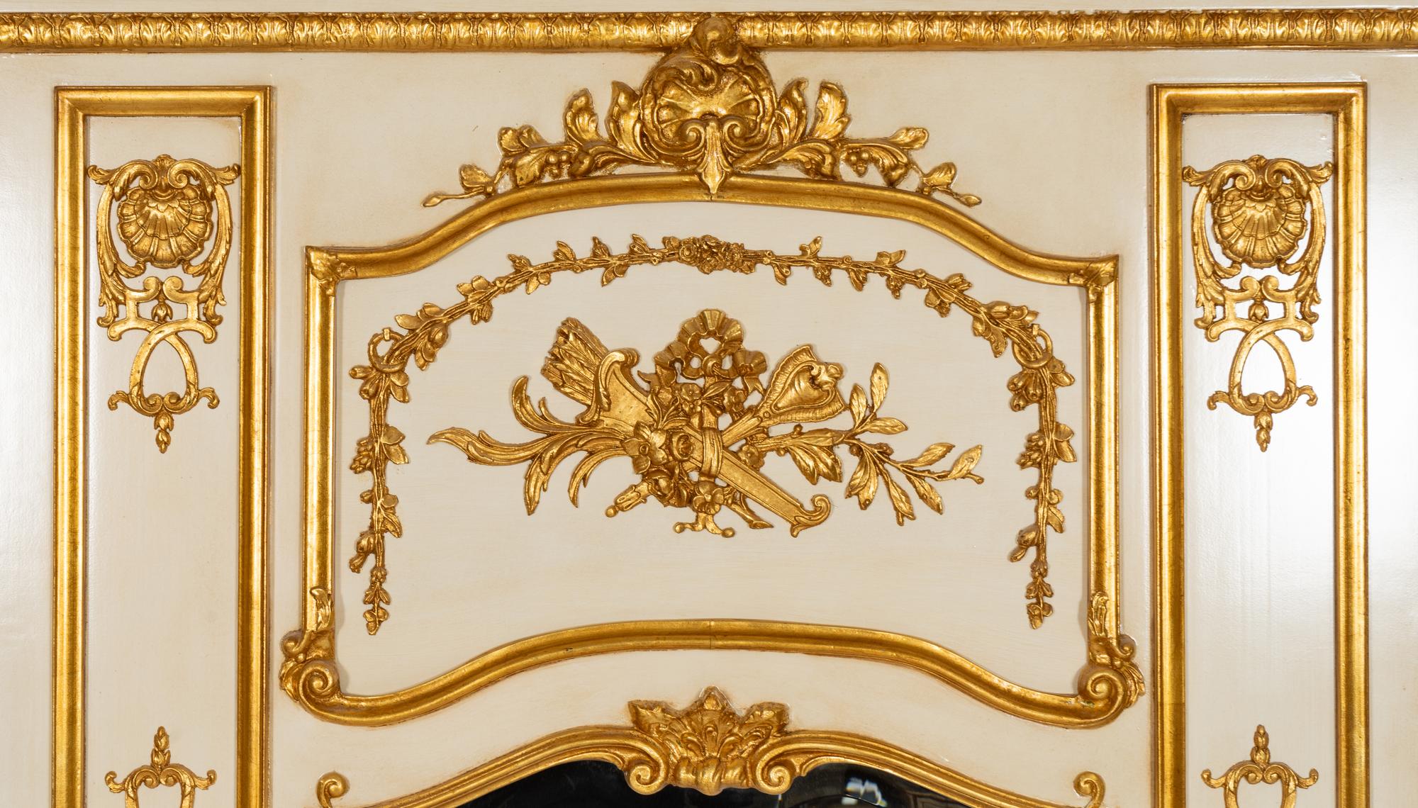 A Pair of Louis XVI Style Cream-Painted and Parcel Gilt Mirrors