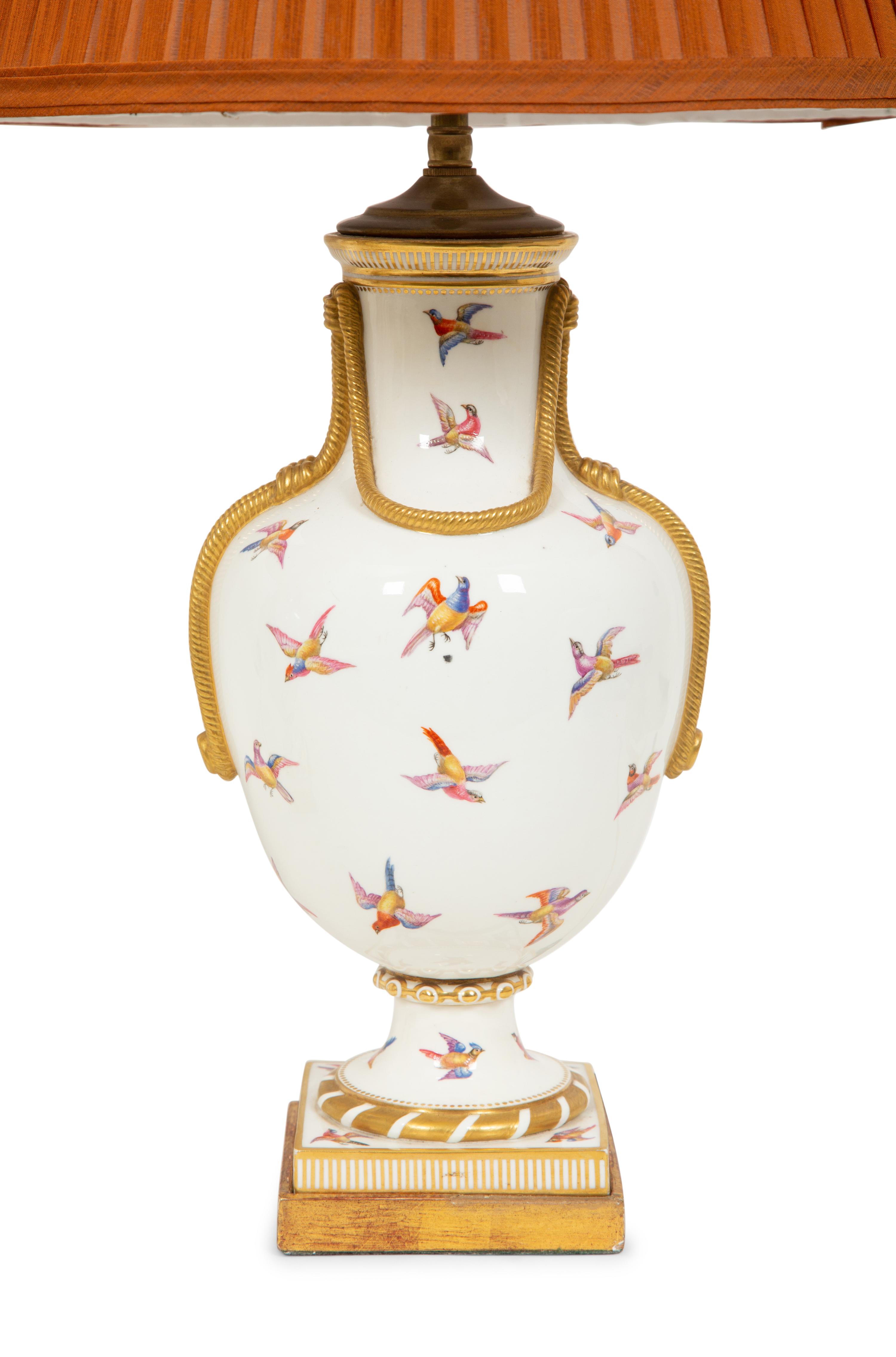A Pair of Parcel-Gilt Painted Porcelain Table Lamps
