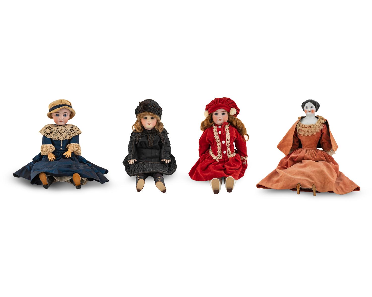 Three Continental Bisque Dolls and a Porcelain Doll — 20TH CENTURY