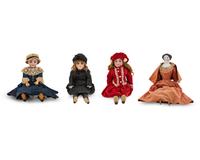 Three Continental Bisque Dolls and a Porcelain Doll — 20TH CENTURY