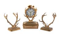 A Continental Gilt Metal Clock Garniture, Height of clock 8 3/4 inches.