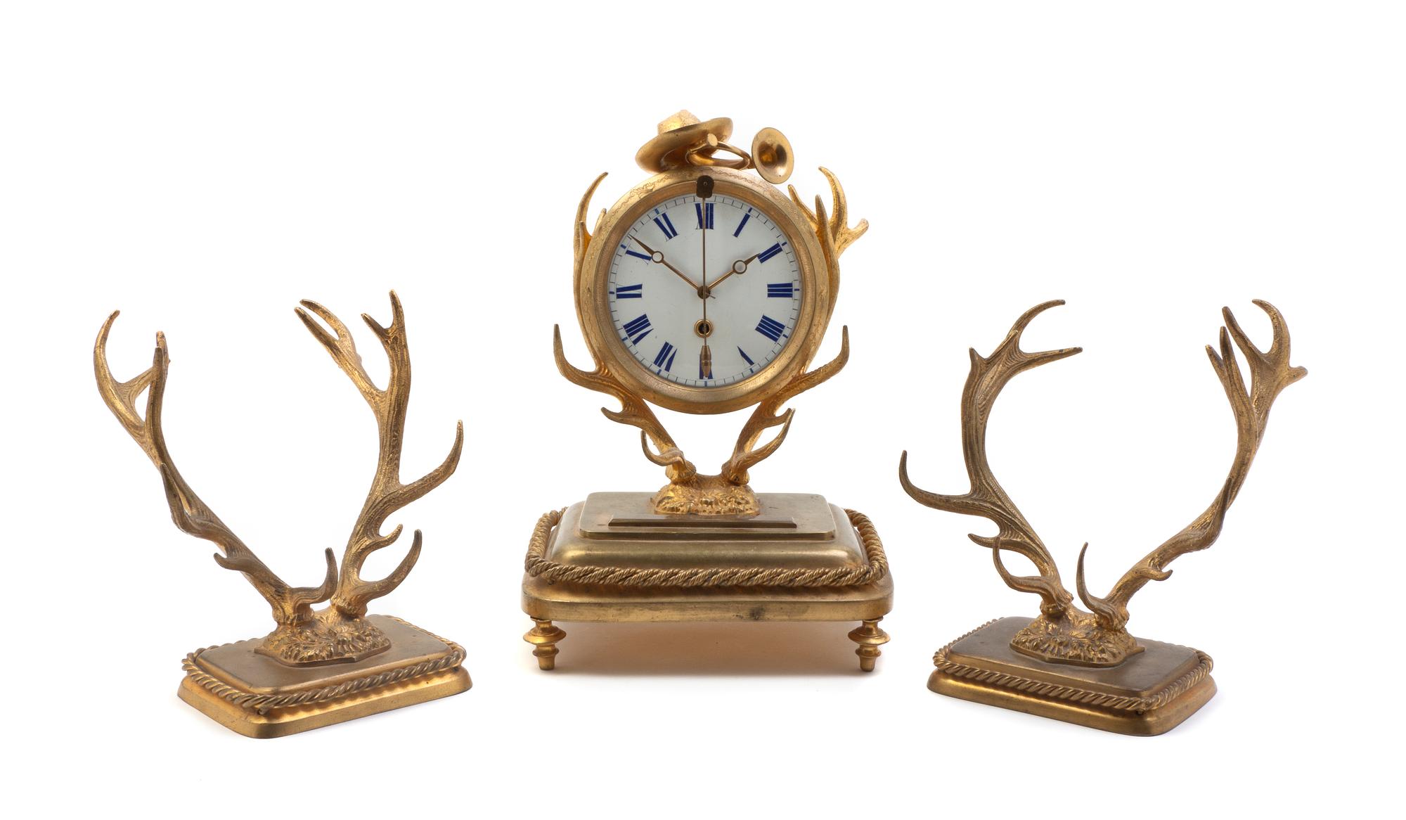 A Continental Gilt Metal Clock Garniture, Height of clock 8 3/4 inches.