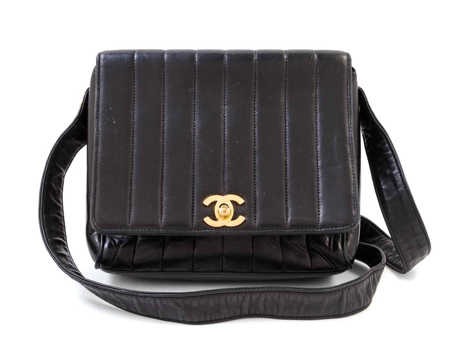 A Chanel Black Lambskin Vertical Quilt Flap Shoulder Bag, 7.5" x 7" x 2". Strap drop: 19".