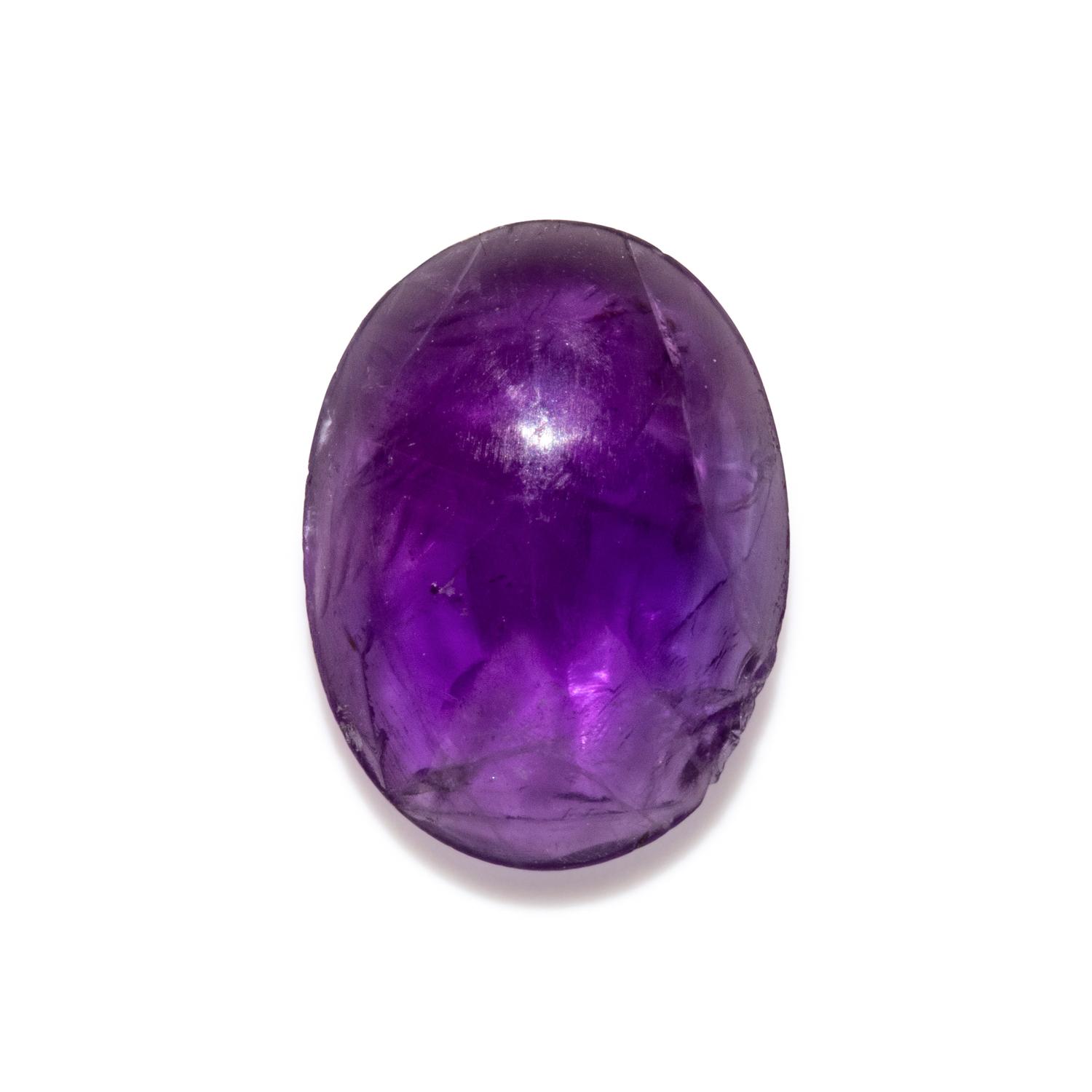 A Roman Amethyst Intaglio with Eros Stringing His Bow