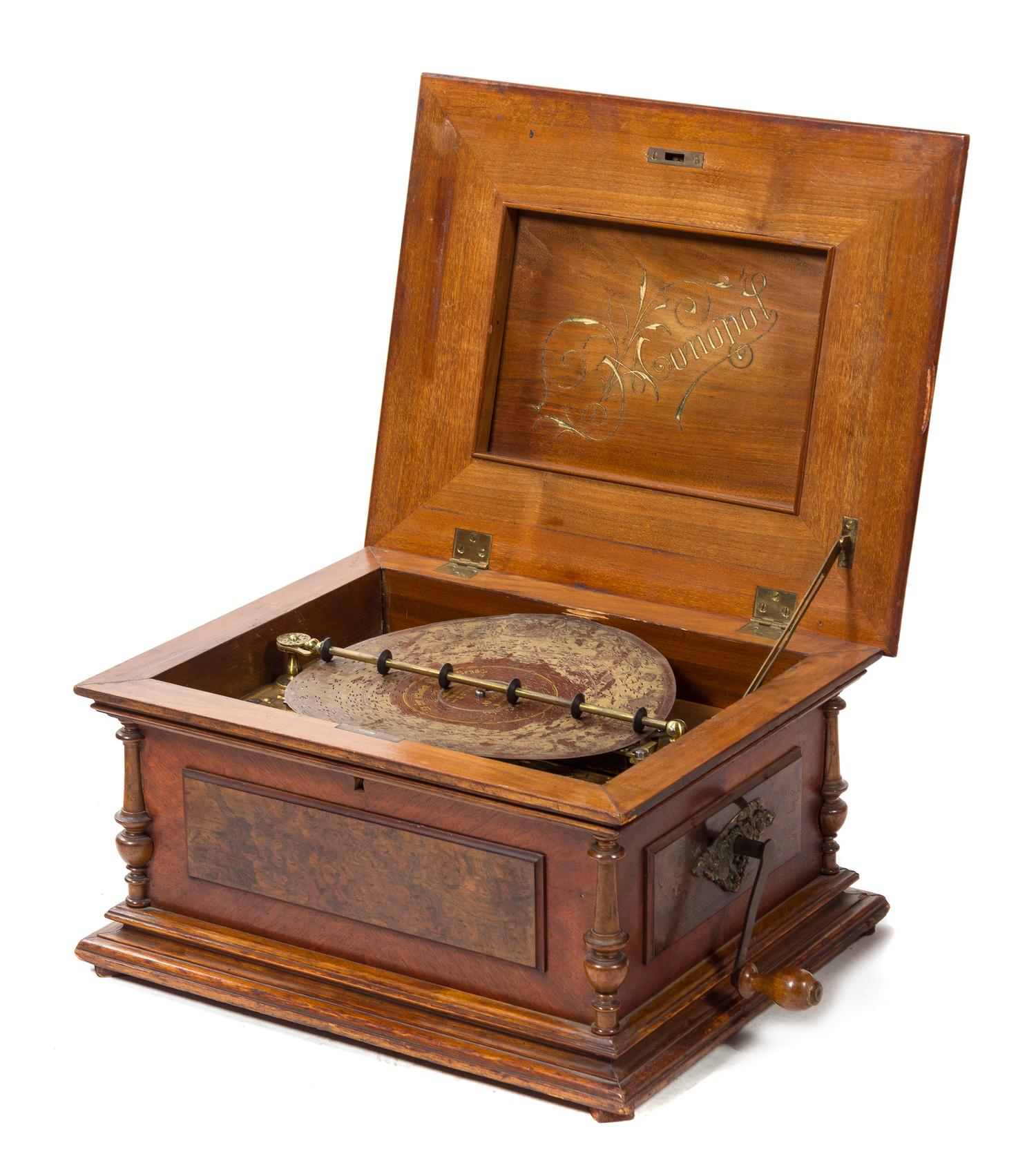 A Symphonium Disk Music Box Width of case 19 3/4 inches.