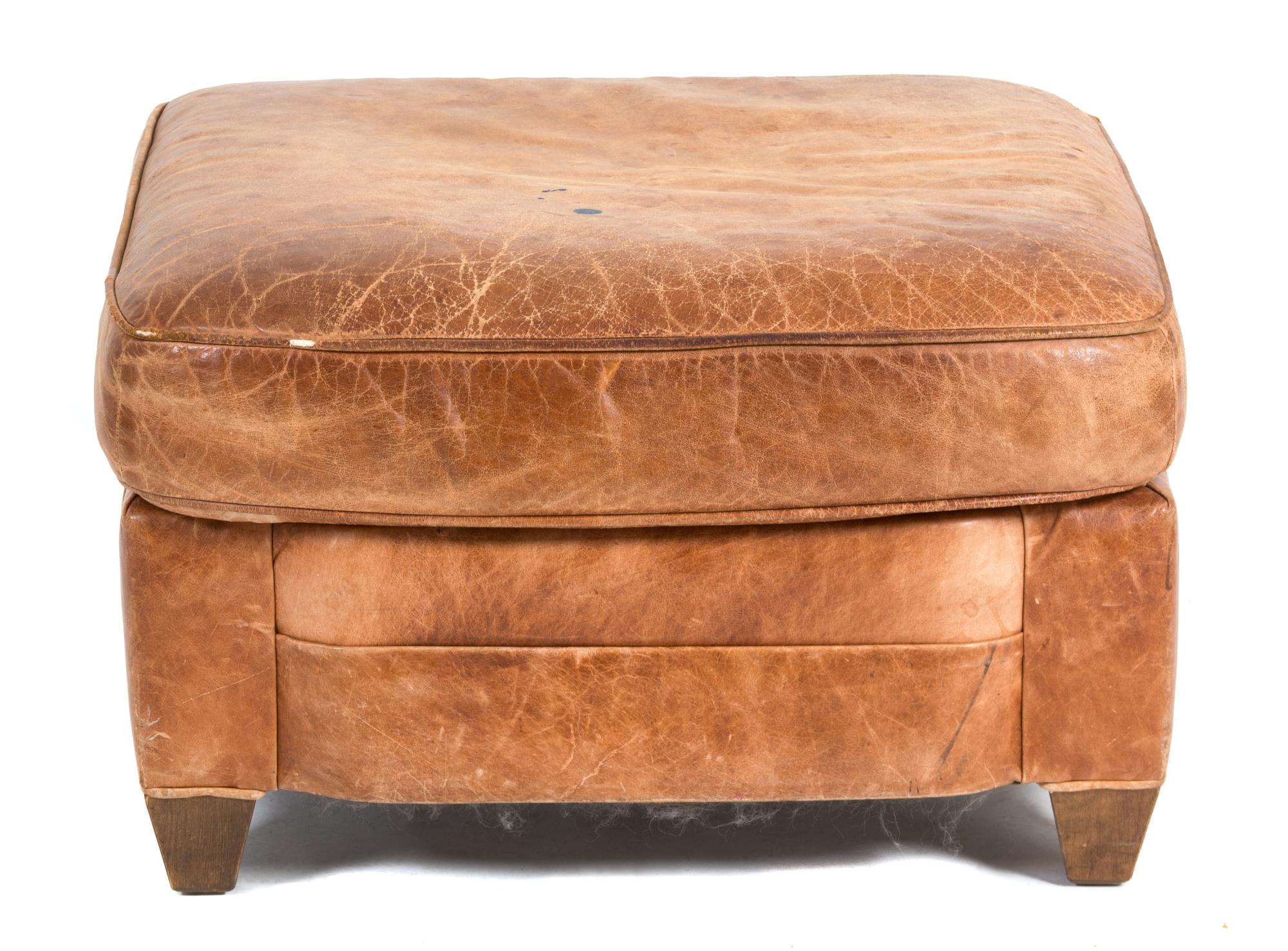 A Contemporary Brown Leather Ottoman Height 17 x width 27 x depth 25 inches. — 20TH CENTURY