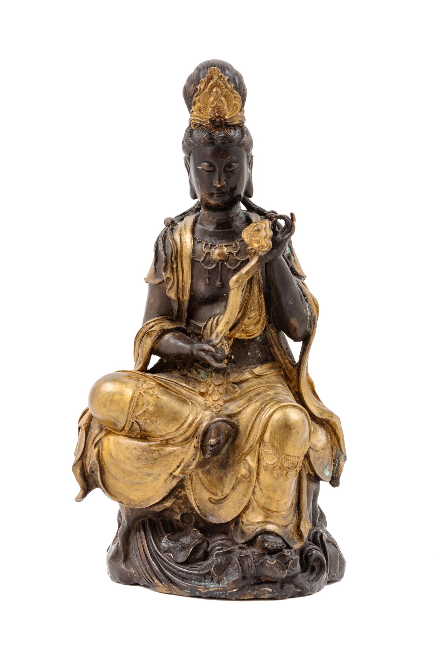A Chinese Gilt and Patinated Bronze Figure