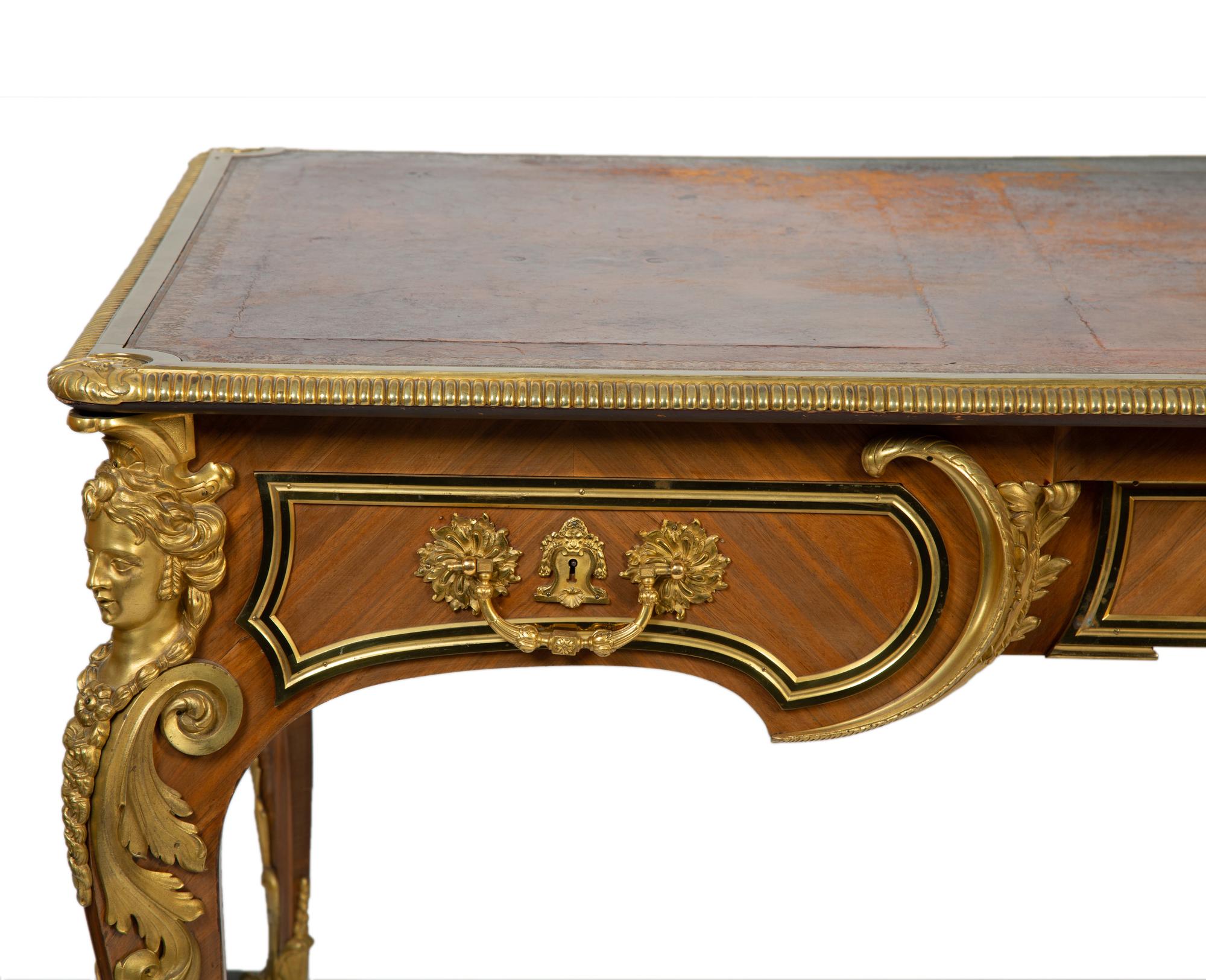 A Louis XVI Style Mahogany and Gilt Bronze Mounted Partners Bureau Plat — L. CUEUNIERES, THIRD QUARTER 19TH CENTURY
