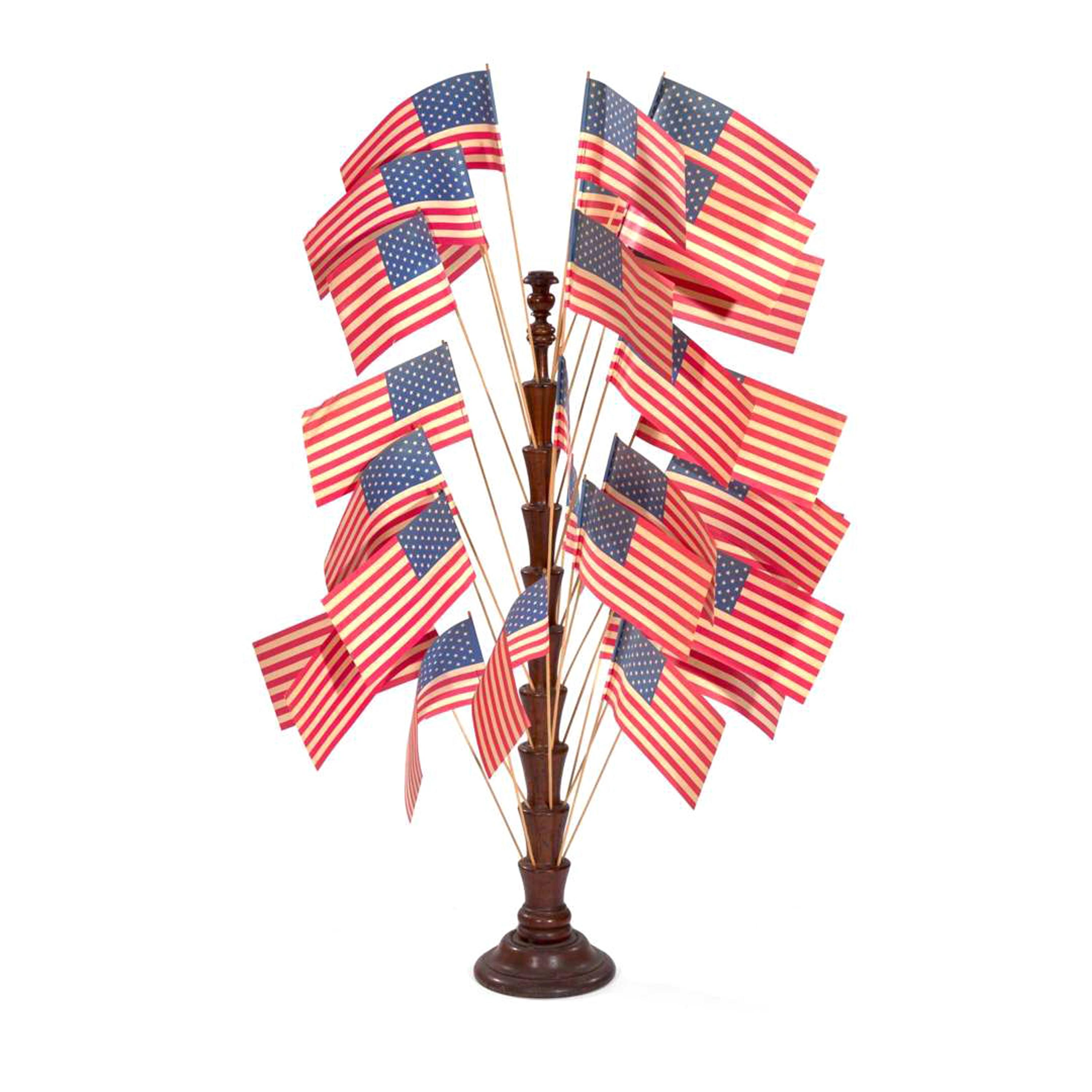 [FLAGS]. A turned wooden flag tree stand. Late 19th-early 20th century.