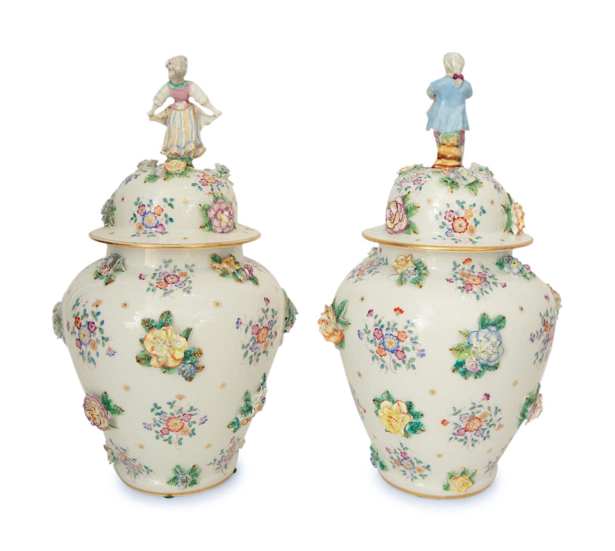 A Pair of Meissen Porcelain Covered Jars with Figural Finials