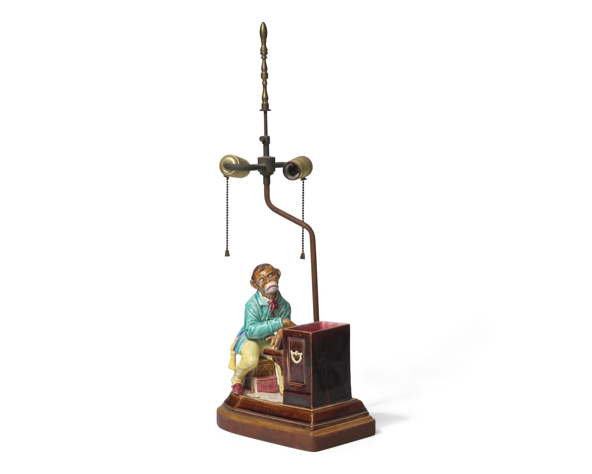 A French Majolica Humidor in the Form of Monkey Playing the Piano, Mounted as a Lamp