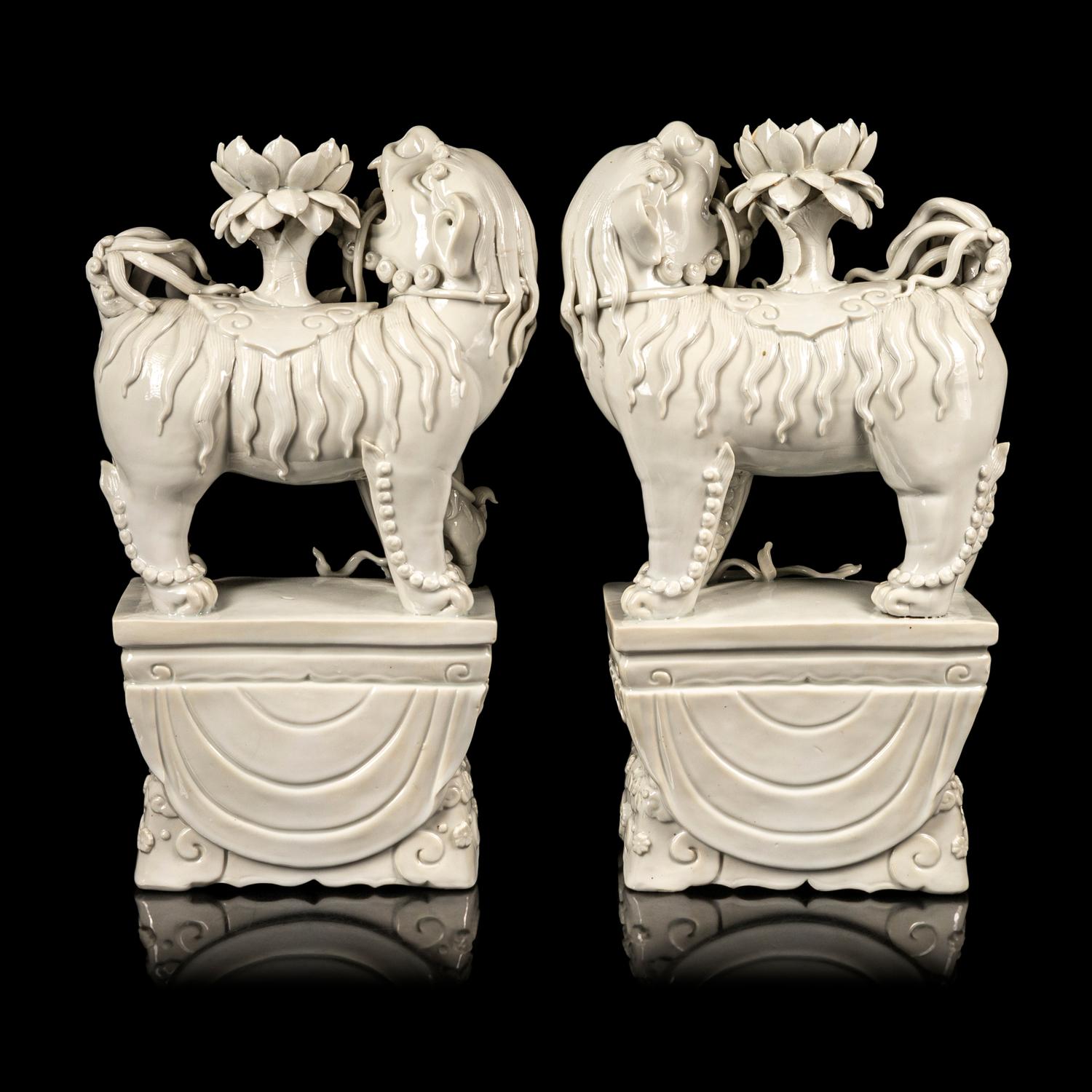 A Pair of Chinese Blanc-de-Chine Figures of Fu Lions