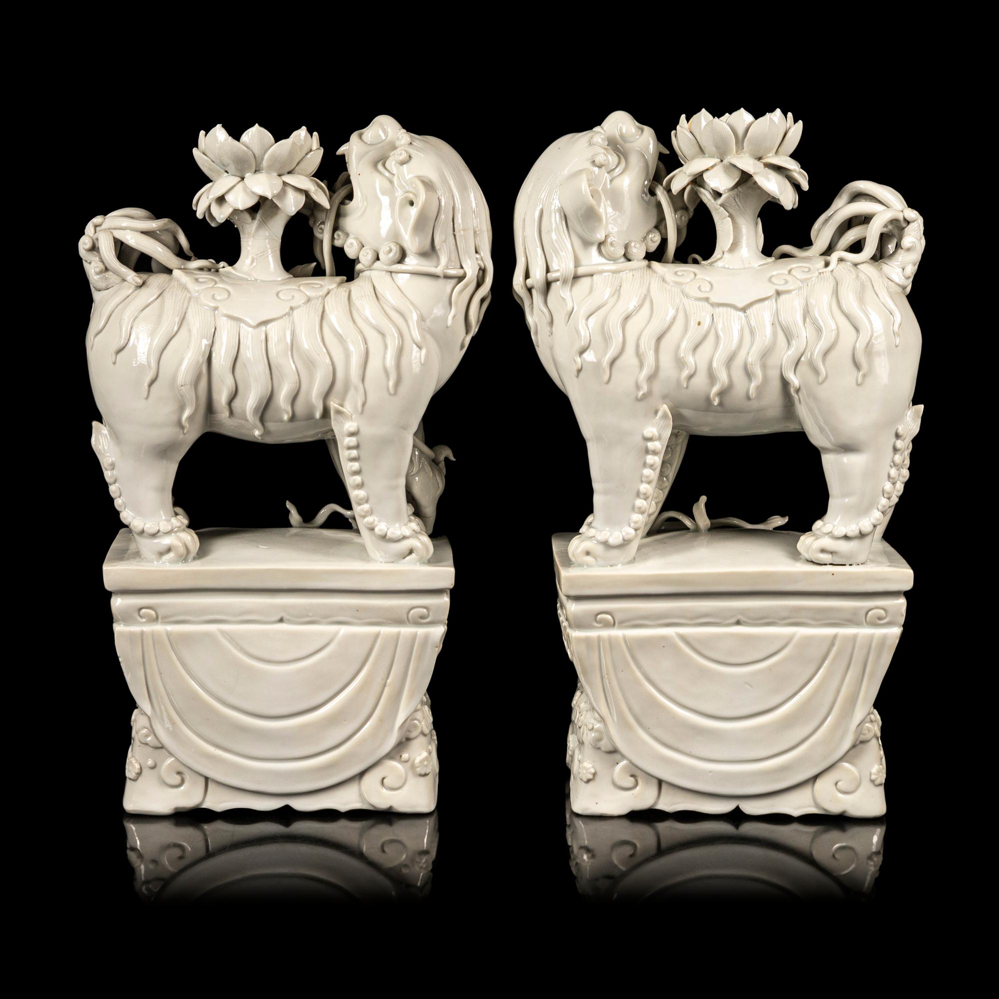 A Pair of Chinese Blanc-de-Chine Figures of Fu Lions