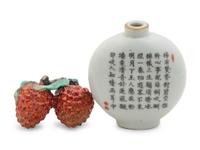 A Chinese Famille Rose Porcelain Snuff Bottle and a Porcelain Model of Double Lychee