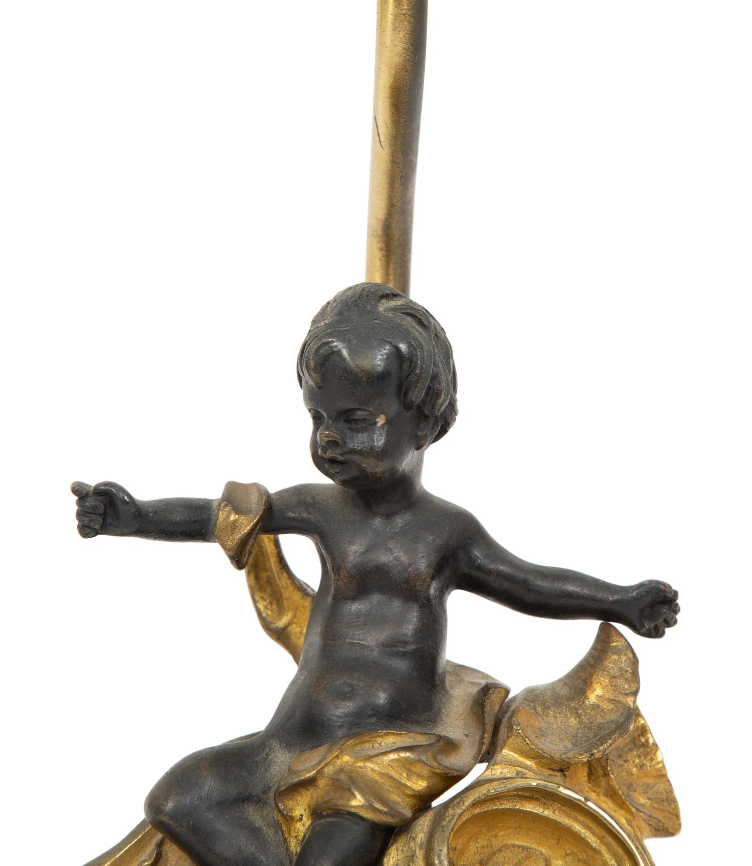 A Louis XV Style Gilt and Patinated Bronze Chenet Mounted as a Lamp