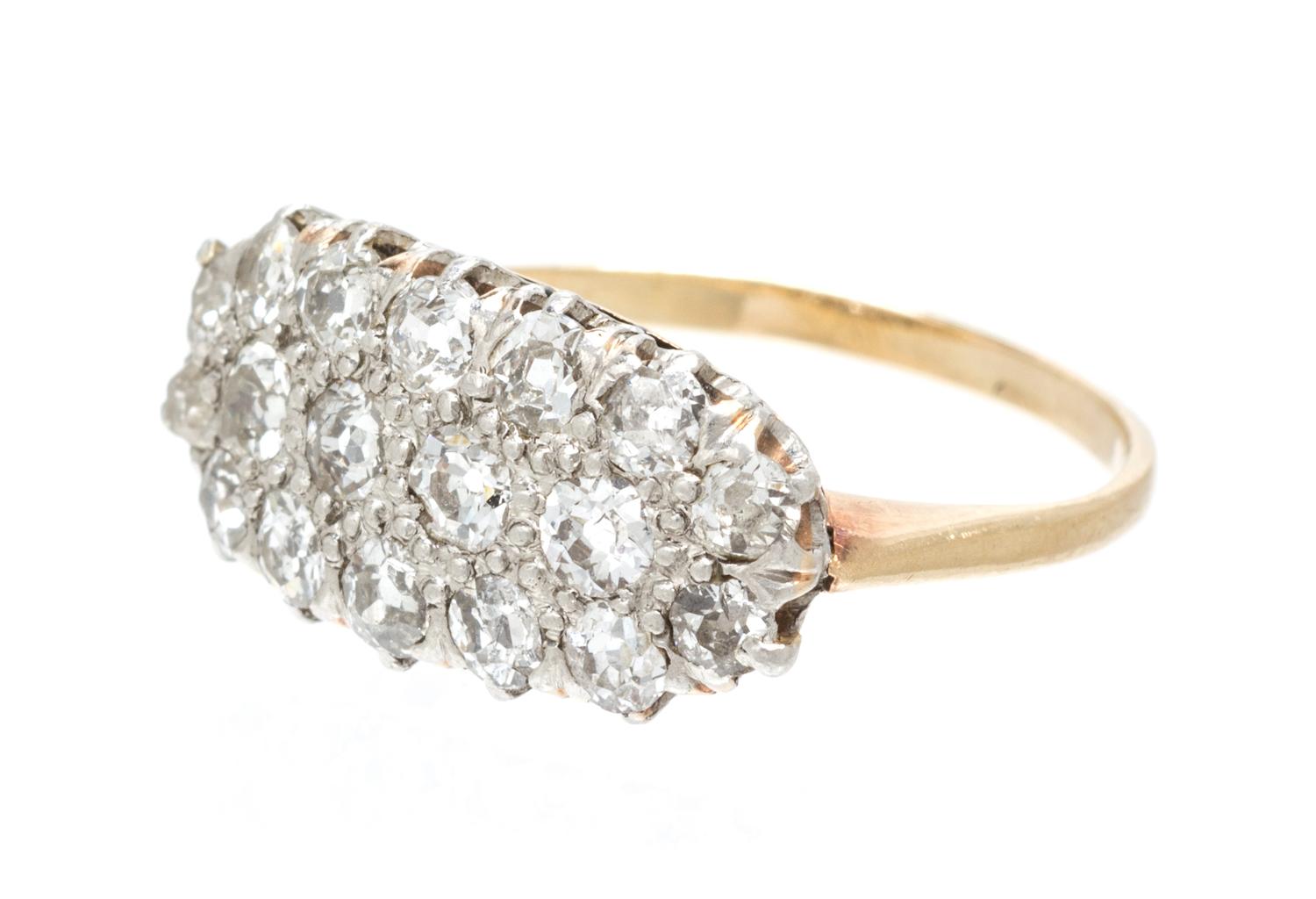 An Edwardian Platinum Topped Yellow Gold and Diamond Cluster Ring, 3.80 dwts.