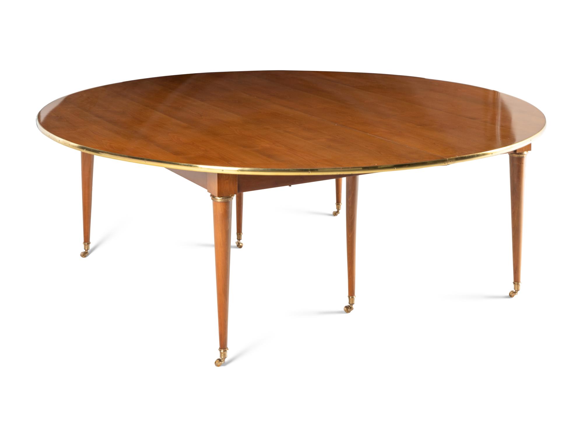 A Directoire Style Brass Mounted Walnut Dining Table