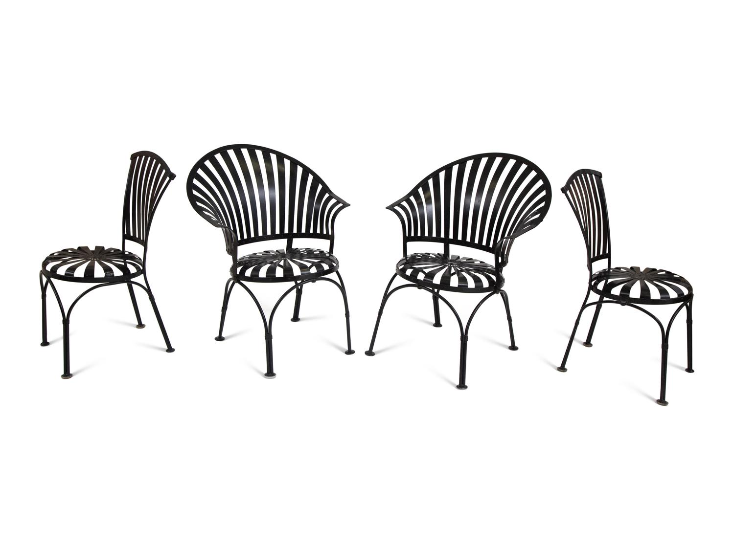 A Spring Steel Garden Table and Eight Chairs by Francois Carre
