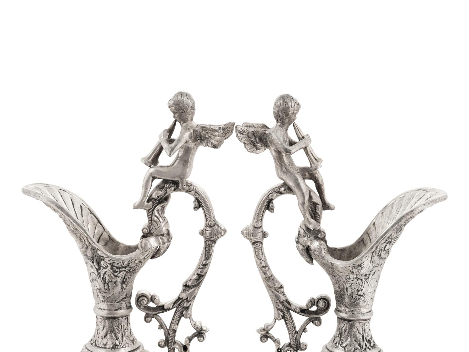 A Pair of Neoclassical Style White Metal Ewers