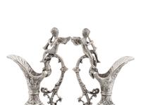 A Pair of Neoclassical Style White Metal Ewers