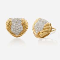 A pair of diamond and bicolor gold ear clips