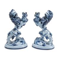 A Pair of French Faience Lion-Form Candlesticks
