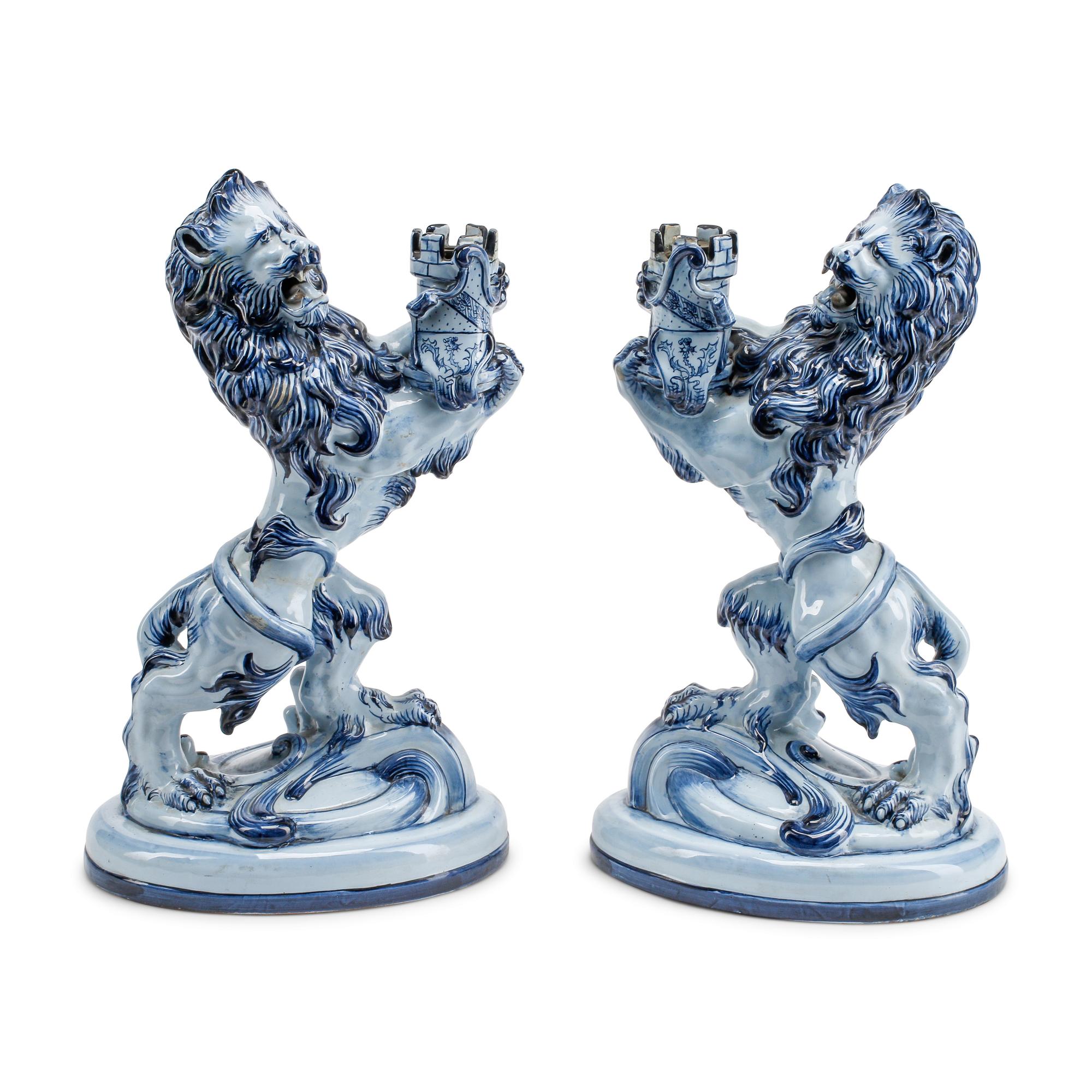 A Pair of French Faience Lion-Form Candlesticks