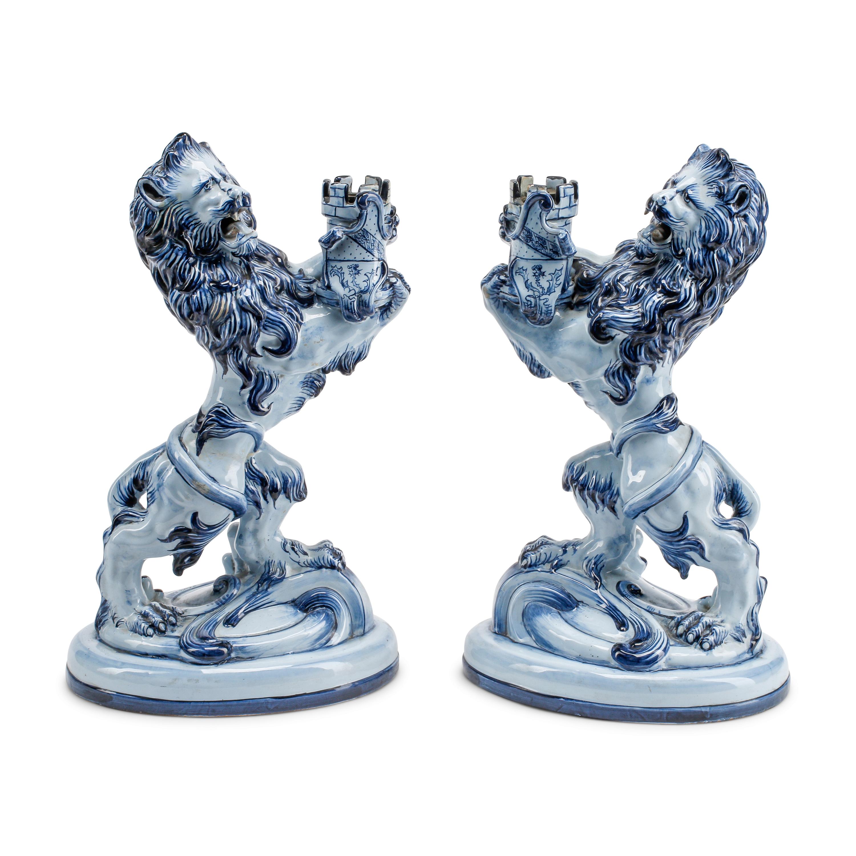 A Pair of French Faience Lion-Form Candlesticks