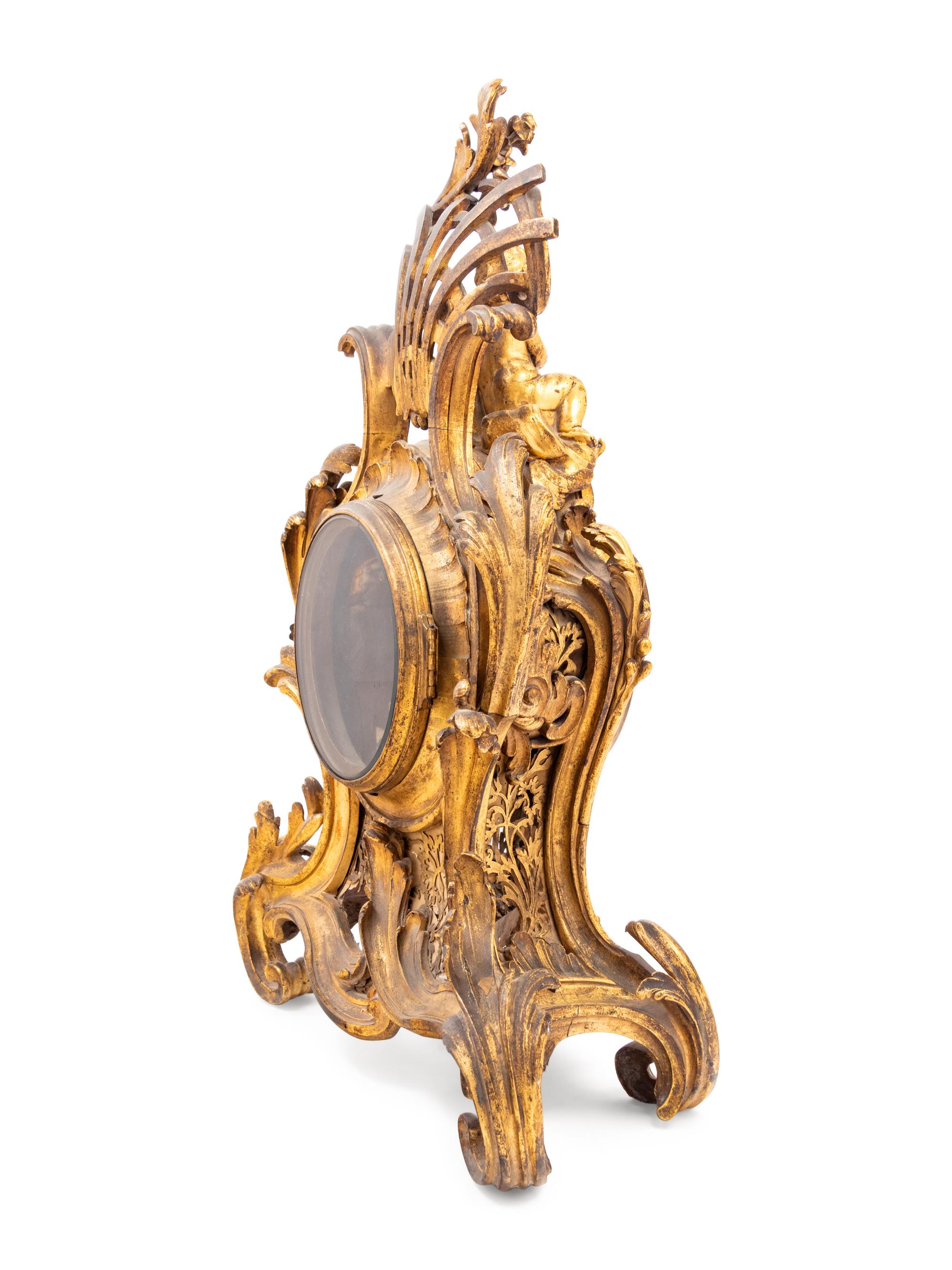 A Louis XV Gilt Bronze Clock and Stand
