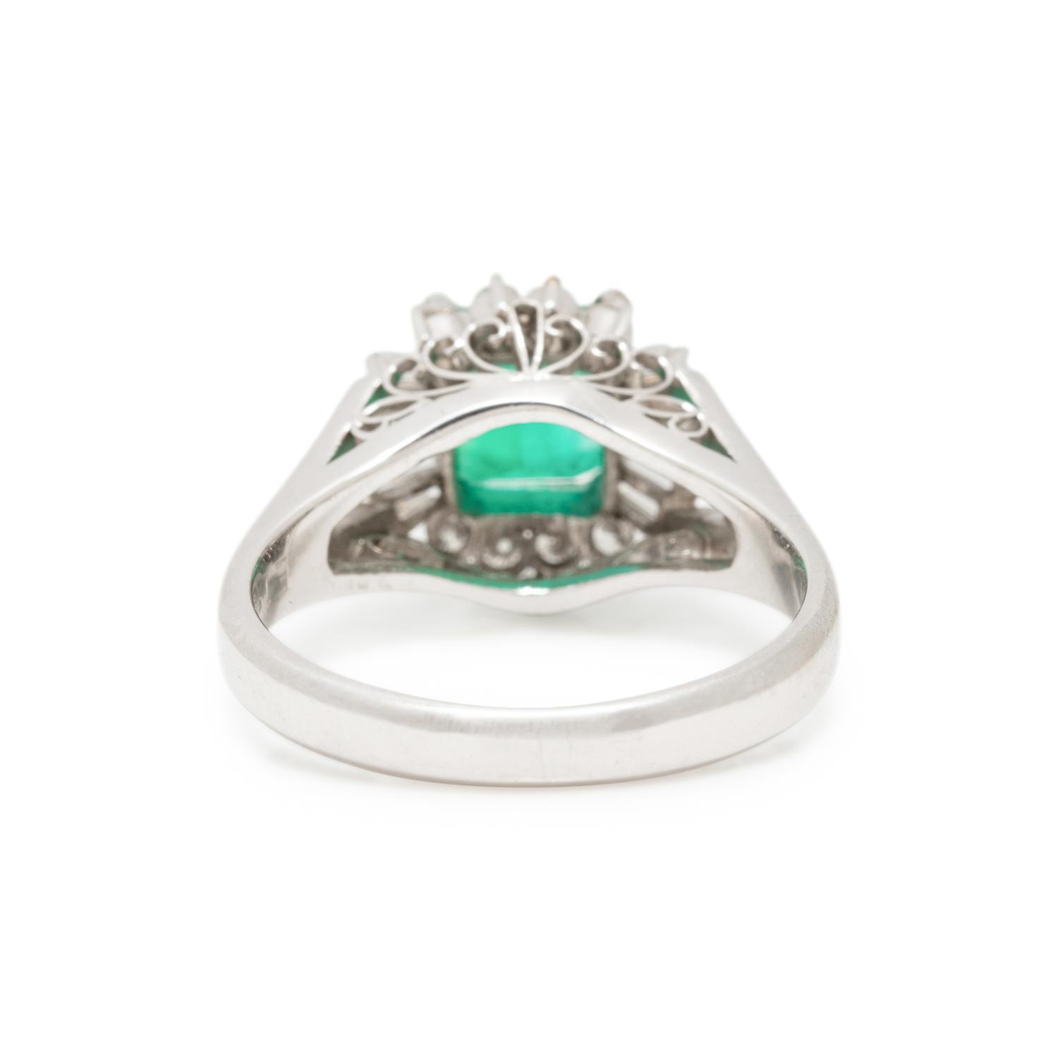 PLATINUM, EMERALD, AND DIAMOND RING