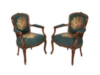 A Pair of Louis XV Style Walnut Fauteuils
