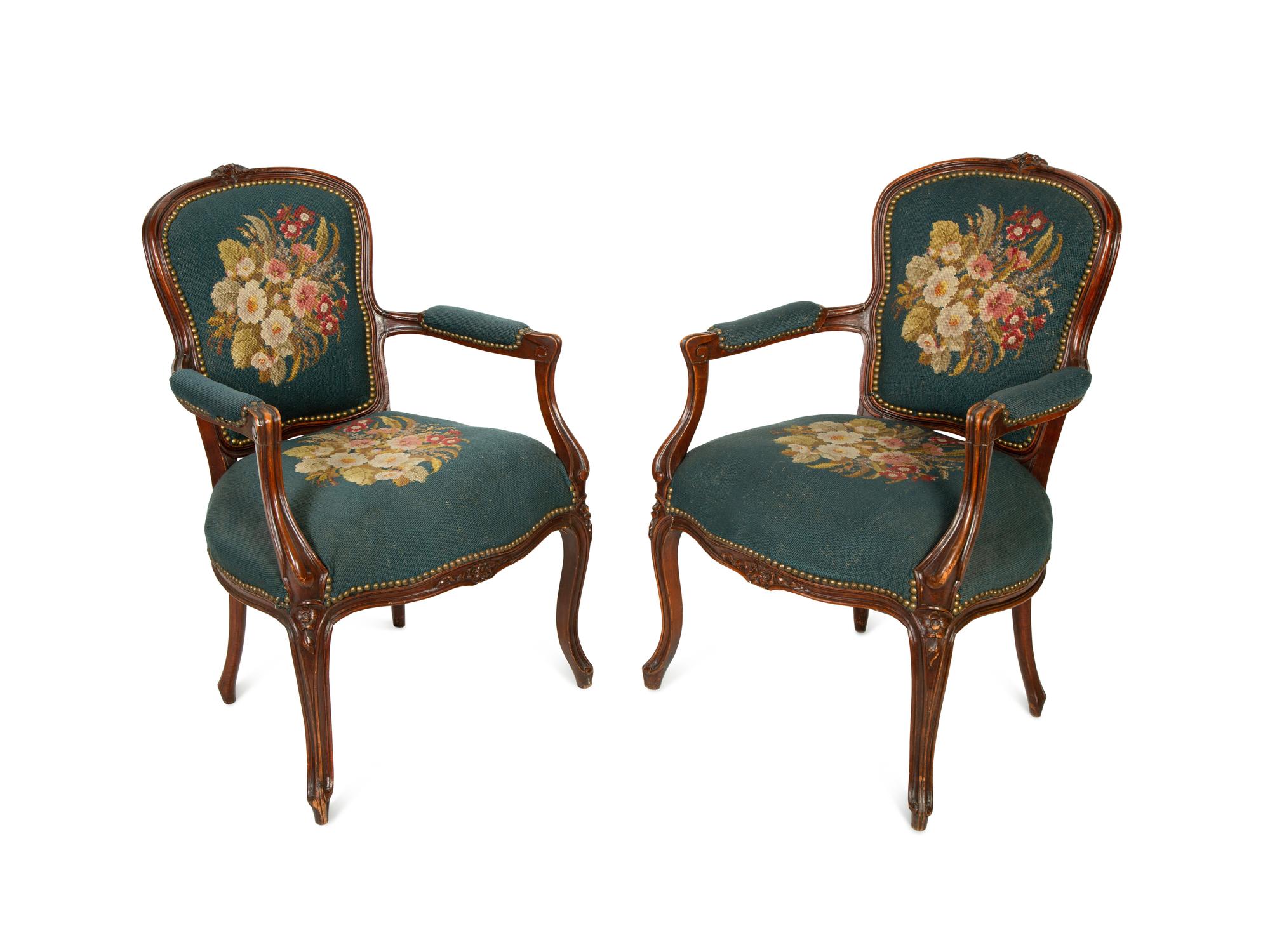 A Pair of Louis XV Style Walnut Fauteuils