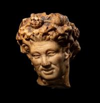 A Roman Marble Head of a Satyr