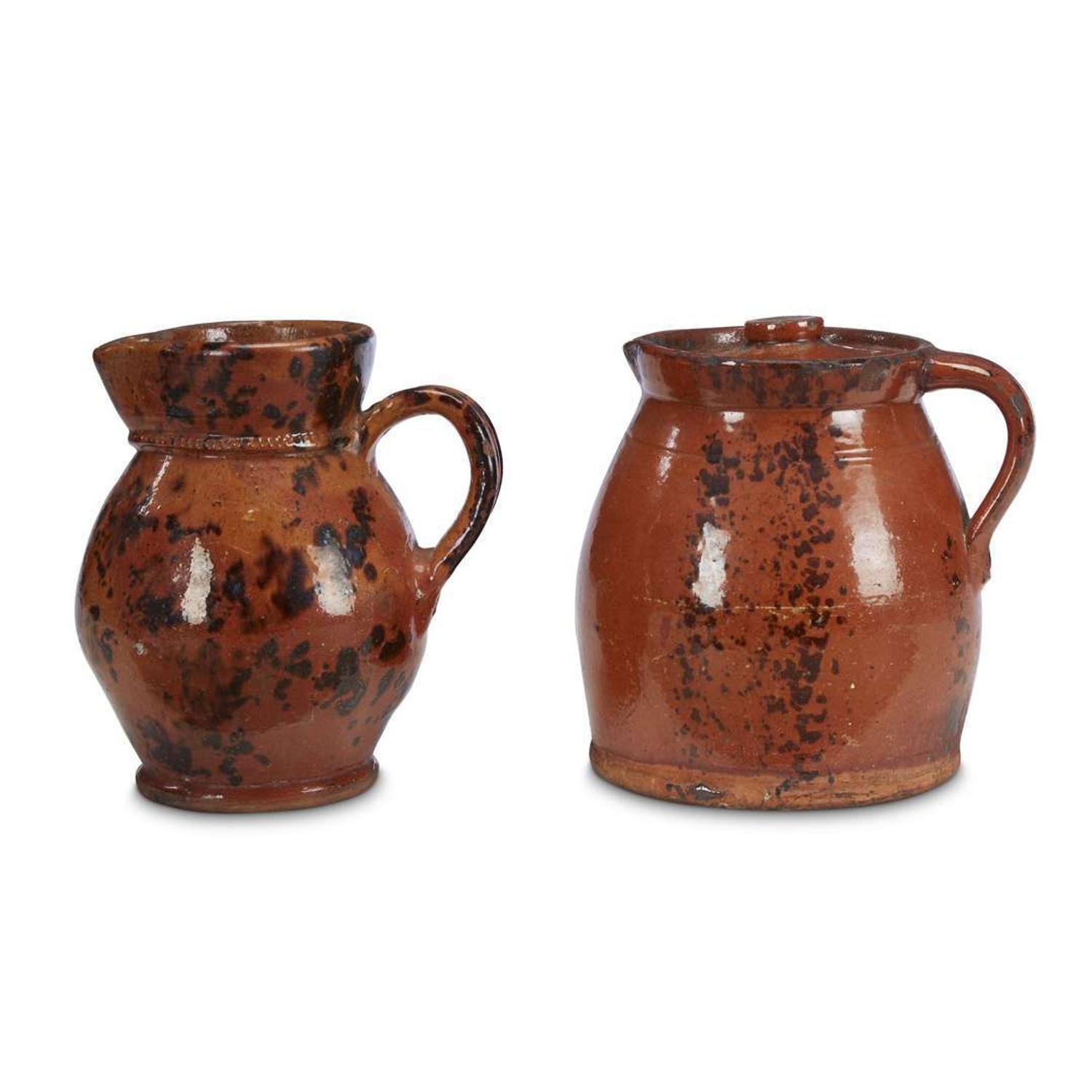 Two glazed redware jugs 19th century