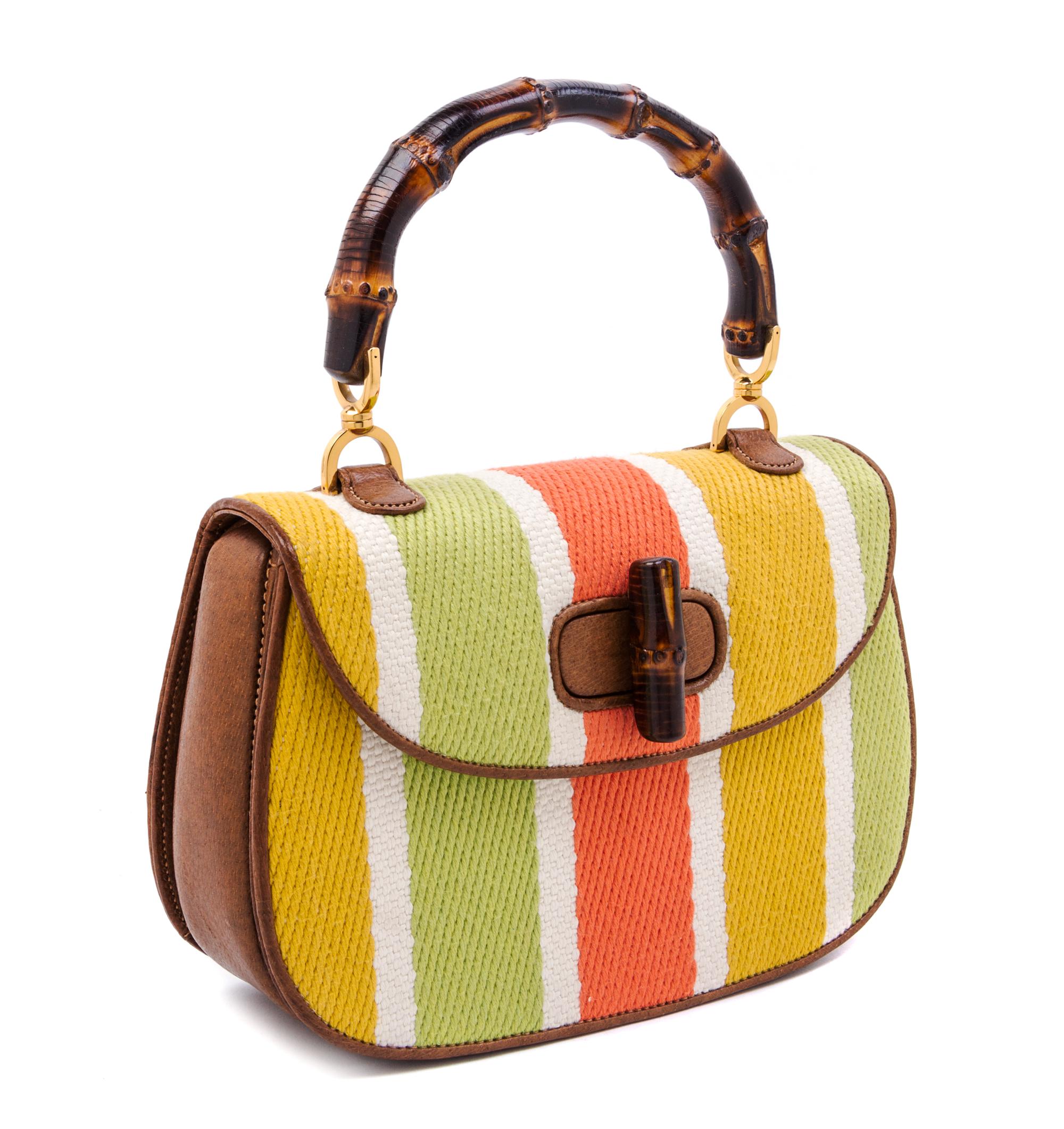 A Gucci Brown Leather and Woven Bamboo Top Handle Handbag, 10.5" x 7" x 3".