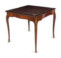 A Louis XV Style Gilt Bronze Mounted Tulipwood Flip-Top Writing Table