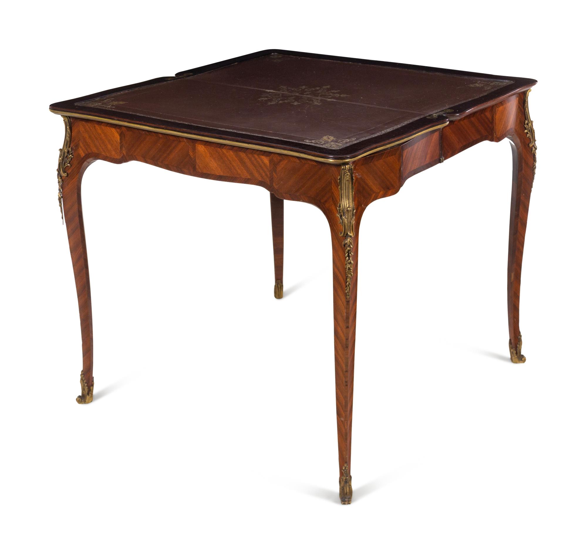 A Louis XV Style Gilt Bronze Mounted Tulipwood Flip-Top Writing Table