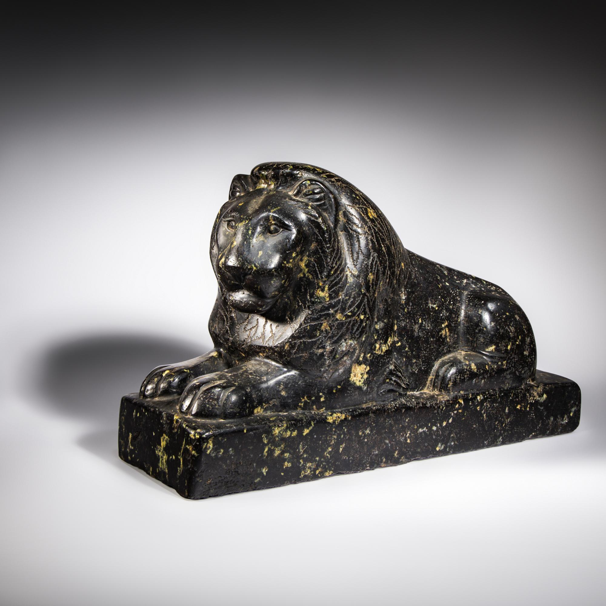 An Egyptian Black Marble Recumbent Lion
