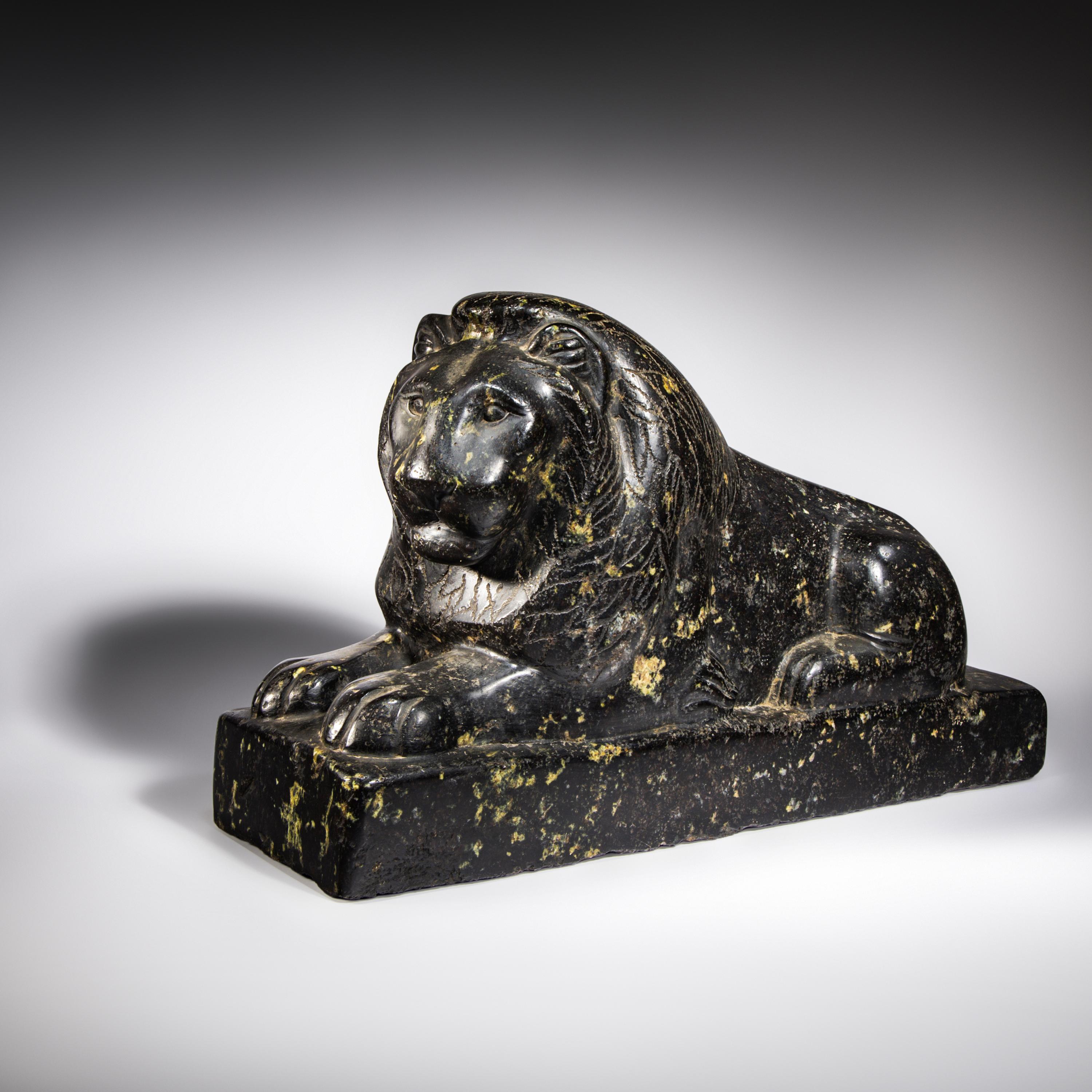 An Egyptian Black Marble Recumbent Lion