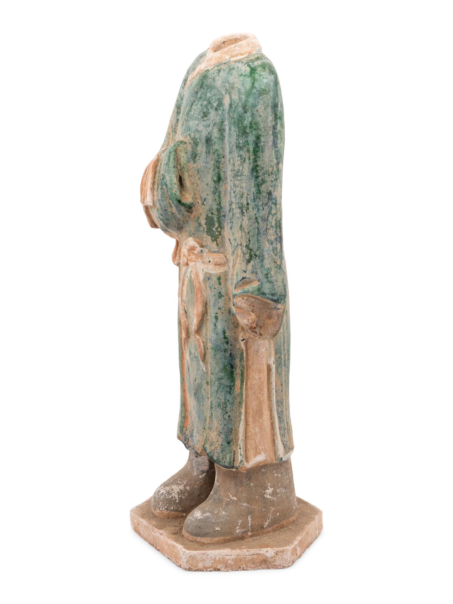 A Chinese Polychrome Decorated Terra Cotta Standing Figure