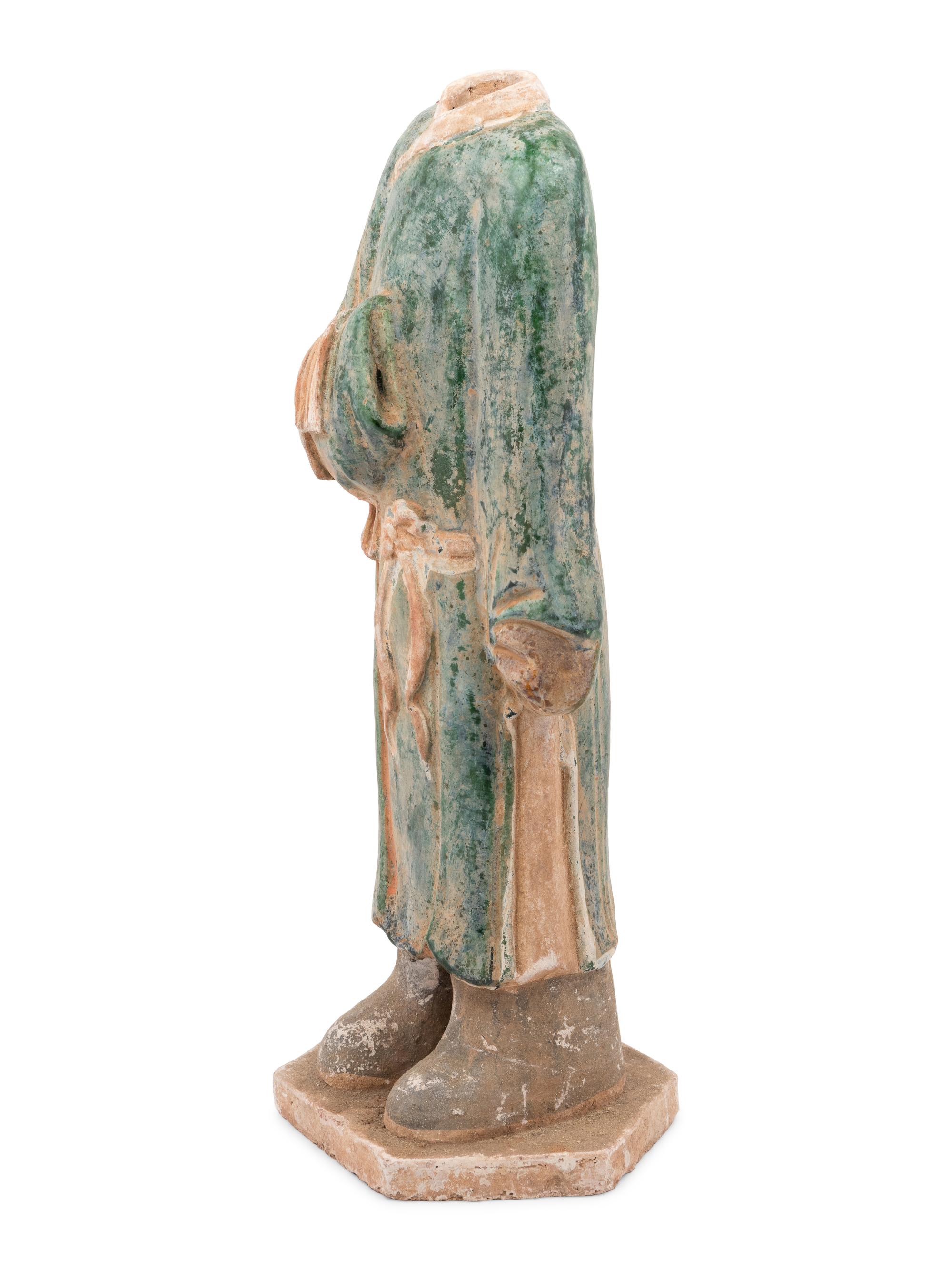 A Chinese Polychrome Decorated Terra Cotta Standing Figure