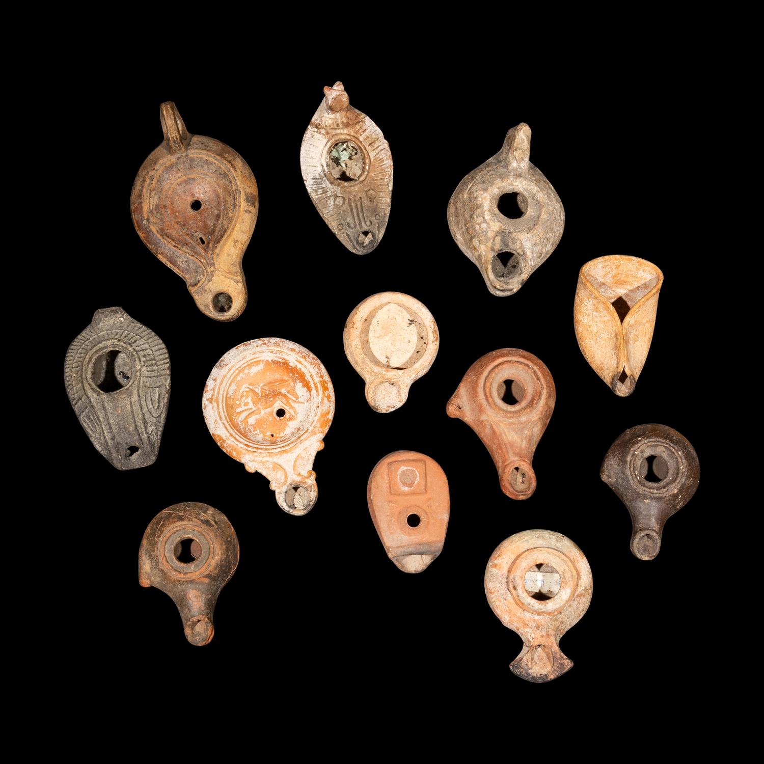 Twelve Greco-Roman Terracotta Lamps