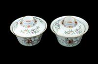A Pair of Chinese Famille Rose Porcelain Covered Tea Bowls and Undertrays
