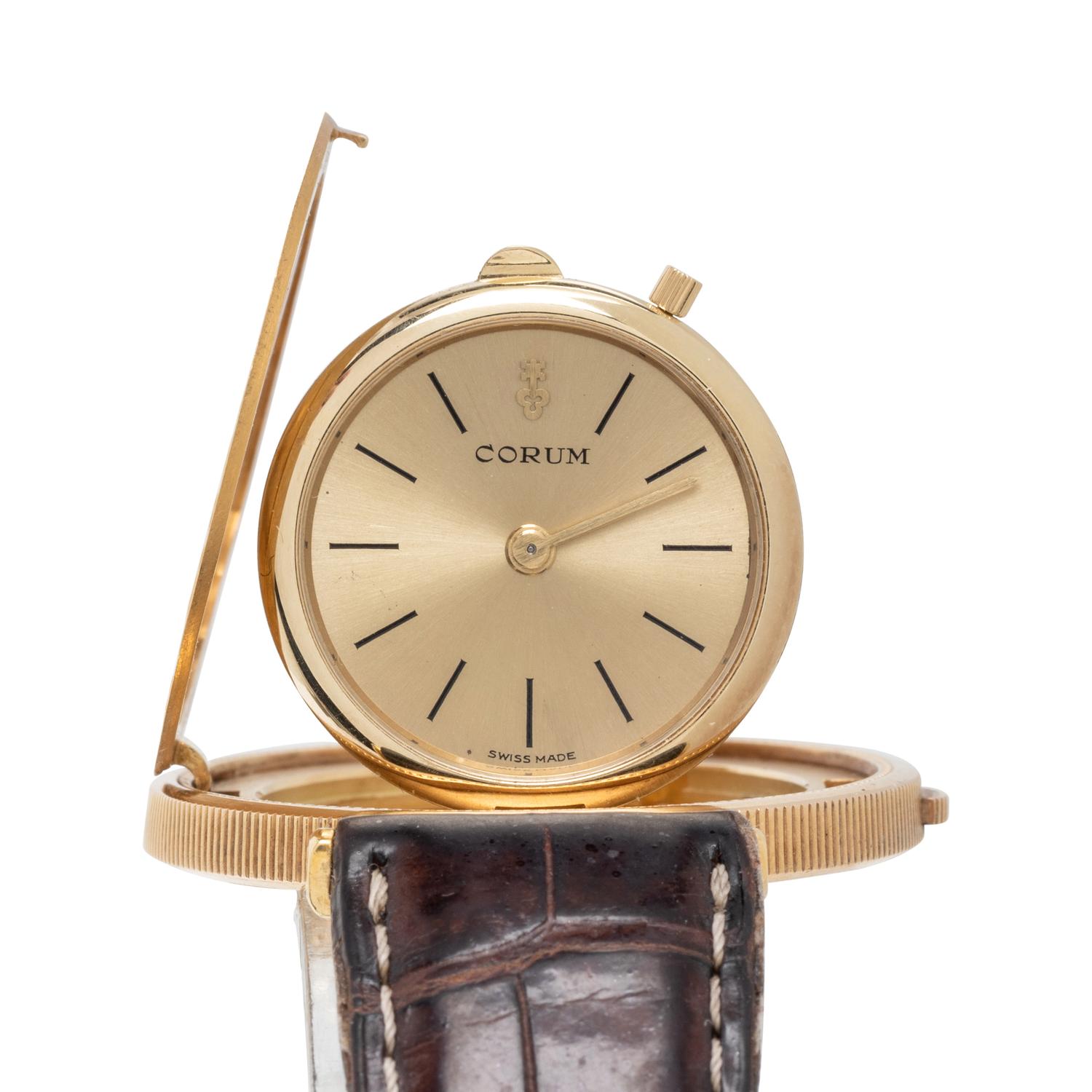 CORUM, 18K YELLOW GOLD HIDDEN DIAL COIN WATCH