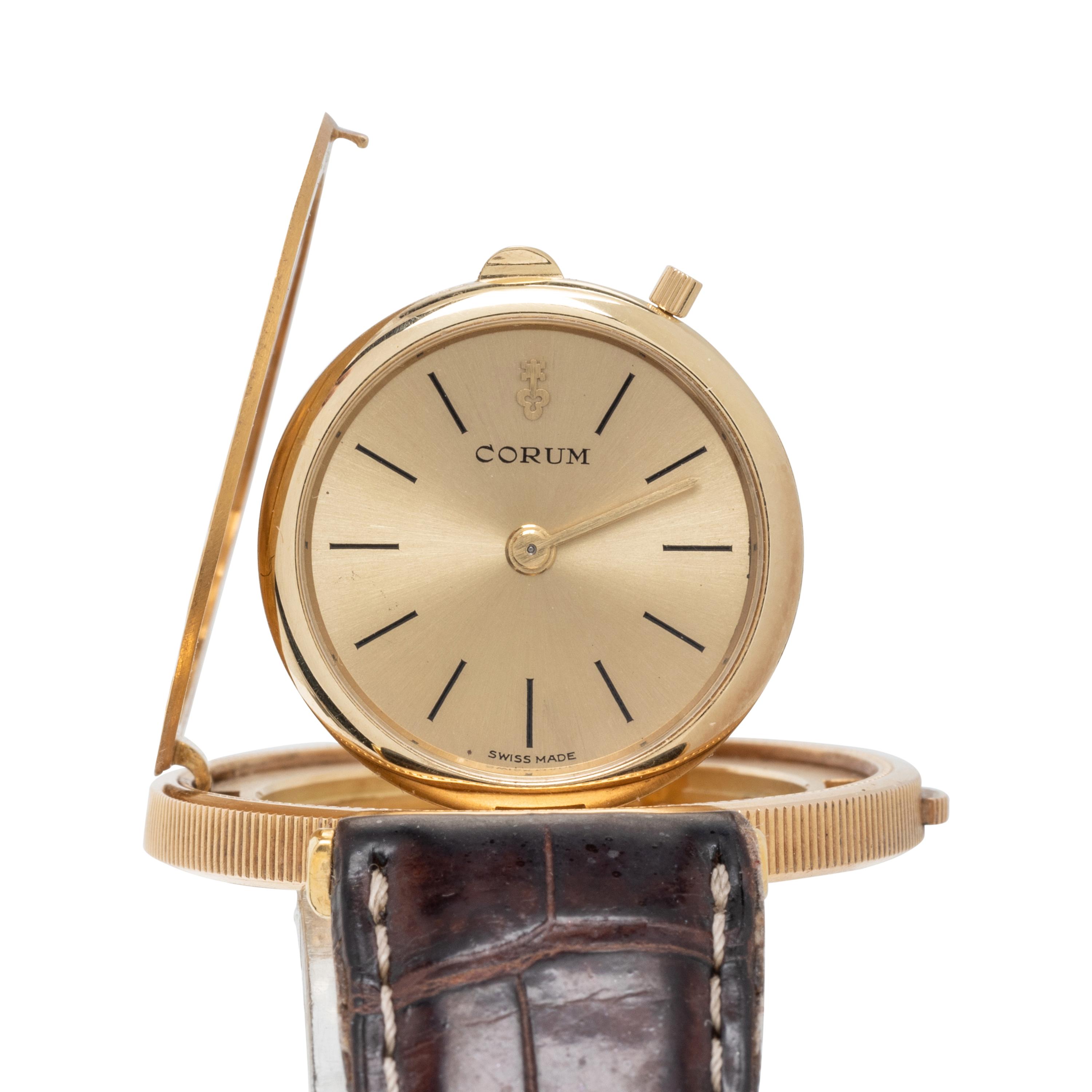 CORUM, 18K YELLOW GOLD HIDDEN DIAL COIN WATCH